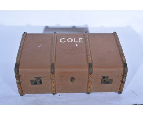 Wooden banded hard bodied trunk, with leather straps.