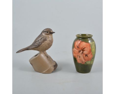 Moorcroft ovoid vase, Hibiscus pattern, 10cm; and a Poole stoneware model of a hedge sparrow. (2)