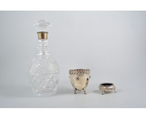 Cut glass mallet-shape decanter, with a silver collar, Arts and Crafts style white metal beaker and a Victorian plated salt, 