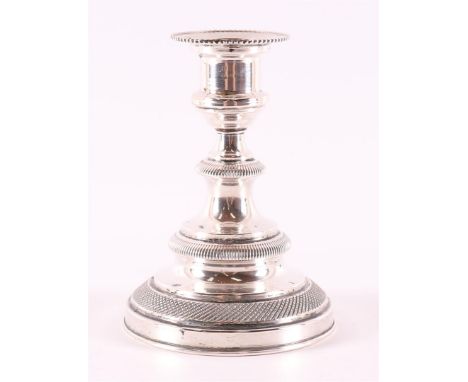 A 3rd grade 800/1000 silver 1-light candlestick, weighted base, 20th century, gross weight 217 grams.