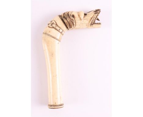 A carved bone walking stick handle in the shape of a dog, 19th century, l 14 x w 9.5 cm. (damaged)