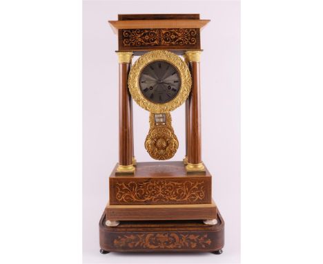 A walnut-glued column mantel clock, France, Napoleon Trois, ca. 1870. Capital and base with marquetry in floral motifs, white