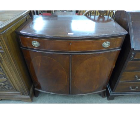 An Edward VII inlaid mahogany bow front side cabinet