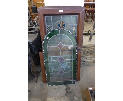 Eight stained glass windows and another stained glass panel