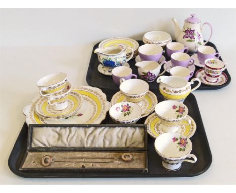 A part set of Aynsley tea cups and saucers etc, "Palissy" tea cups, tea pot etc and two mother of pearl hat pins in a box Unf