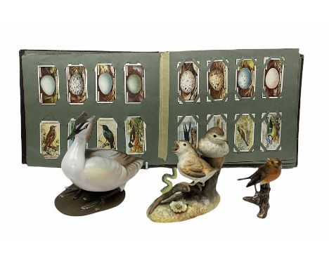 Three ceramic bird figures comprising Royal Crown Derby thrush chicks, Albany Royal Worcester crested grebe and a Goebel robi