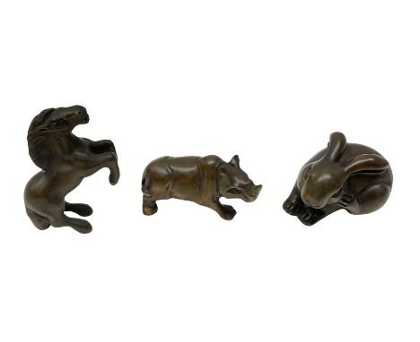 Three netsuke, modelled as a rhino, horse and rabbit