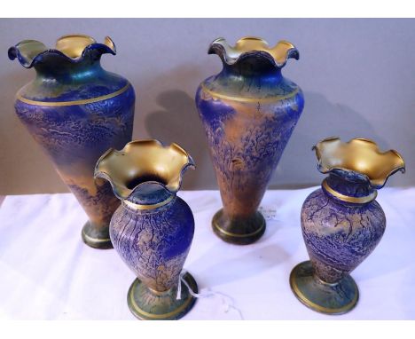 Four Loetz style glass vases, largest H: 18 cm. P&amp;P Group 3 (£25+VAT for the first lot and £5+VAT for subsequent lots) 