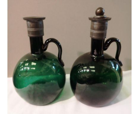 Two green blown glass decanters with white metal rims, H: 19 cm. P&amp;P Group 3 (£25+VAT for the first lot and £5+VAT for su