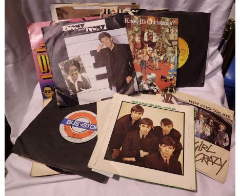 Small quantity of mixed singles to include The Beatles. P&amp;P Group 2 (£18+VAT for the first lot and £3+VAT for subsequent 