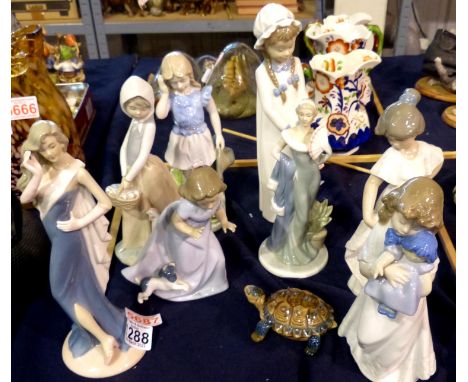 Four Nao figurines and three similar figurines, largest H: 28 cm. (7). P&amp;P Group 3 (£25+VAT for the first lot and £5+VAT 