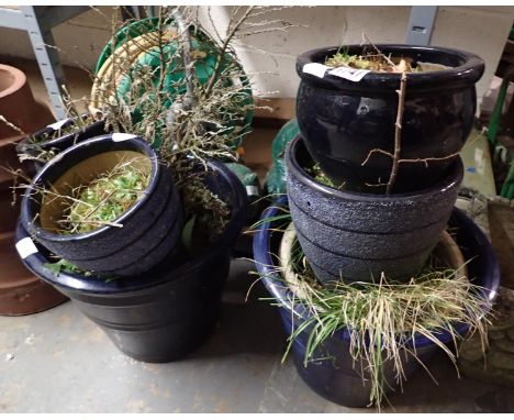 Seven blue glazed ceramic plant pots, largest H: 30 cm. Not available for in-house P&amp;P 