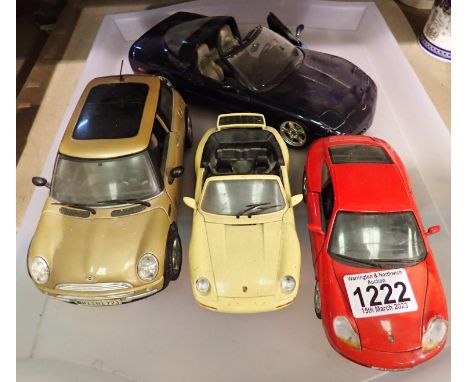 Four diecast model cars to include Burago and Maisto 1/18 and 1/24. P&amp;P Group 2 (£18+VAT for the first lot and £3+VAT for