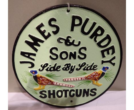 Cast iron James Purdey Shotguns plaque, W: 30 cm. P&amp;P Group 1 (£14+VAT for the first lot and £1+VAT for subsequent lots) 