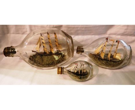 Three graduated Dimple whisky bottles containing hand modelled ships. P&amp;P Group 3 (£25+VAT for the first lot and £5+VAT f