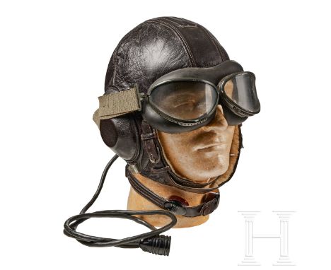 A “LKpW101" Winter Flight Helmet   Five panel, brown leather construction, leather covered earphone mounts with a grooved lip