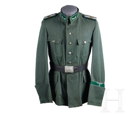 A Customs Service Tunic  Green twill fabric, scalloped and pleated breast pockets, hip bag pockets with scalloped flaps and b