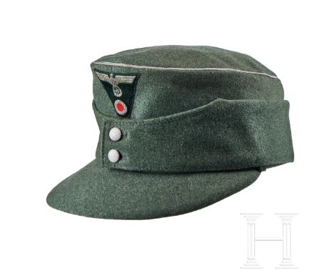 A Field Cap for Officers  Cap body in field-grey wool, piped in silver-aluminum mesh cord, turn-up ear/neck flap with two sil