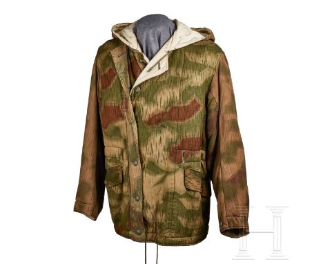 A Reversible Winter Jacket  Heavy, cotton twill, reversible, six-button closure with additional button flap and slanted lower