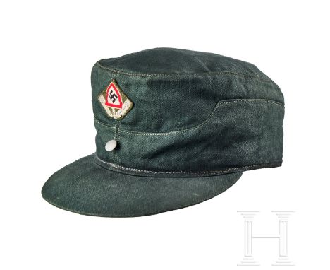 A Field Cap for RAD Other Ranks  Cap body in blue-grey HBT cloth, turn-up ear/neck flap with a single silver finished pebbled