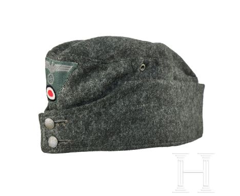 A Garrison Cap for Other Ranks  Cap body of field-grey wool, boat-shaped with scalloped lower panel, single ventilation hole 