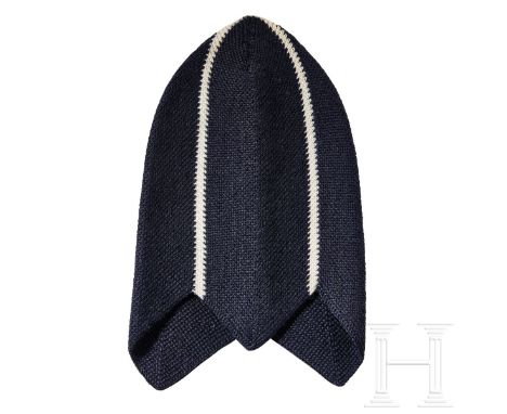 A BDM/JM Winter Knit Cap  Dark-blue knit, cone-shaped head covering with scalloped bottom of three pointed edges, two white s