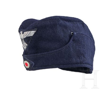 A Garrison Cap for TENO Other Ranks  Cap body of dark-blue/black wool, boat-shaped with scalloped lower panel, hook closures 