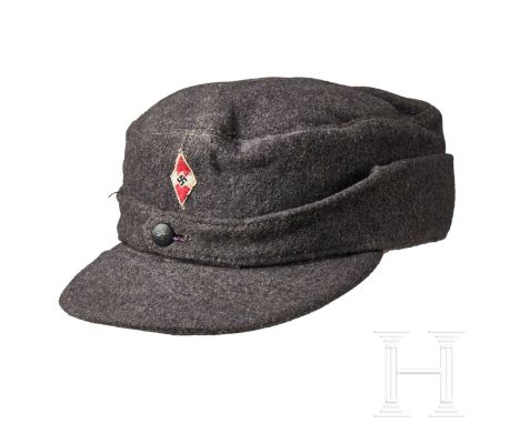 A Field Cap Hitler Youth  Cap body in blue-grey wool, turn-up ear/neck flap with a single blue-grey pebbled button closure at