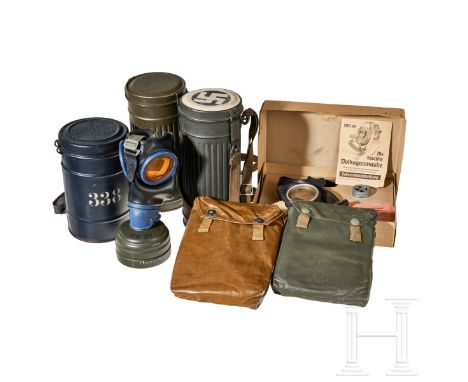 Chemical Protective Equipment  Civilian gas mask, synthetic rubber covering and straps, glass lenses, metal intake canister, 