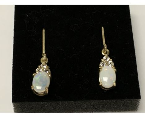 A pair of Opal drop silver earrings.