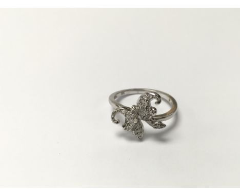 A 9ct white gold ring set with diamonds in the formation of a butterfly. The approximate ring size is between P and Q.