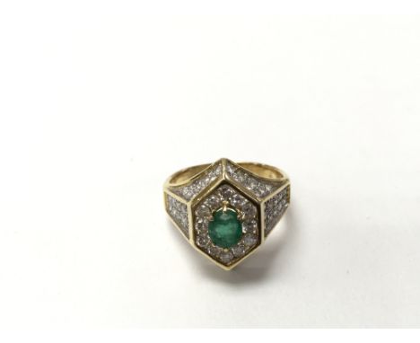 A 9ct emerald and diamond set ring, the approximate ring size is N.