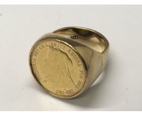 A Victorian Sovereign set in a solid gold ring. Weight 23g