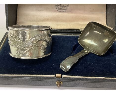 A silver caddy spoon by Joseph Willmore, Birmingham hallmarked circa 1820, and one Chinese silver napkin ring with a dragon m