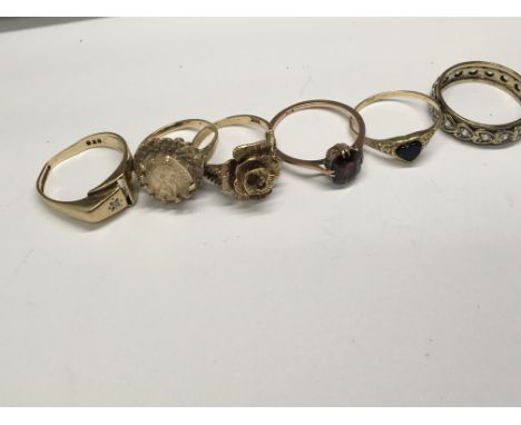 A collection of 9ct gold rings and an 18ct gold ring set with a small diamond total weight 25g