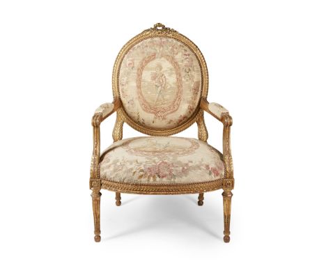 SUITE OF LOUIS XVI GILTWOOD AND AUBUSSON SEAT FURNITURE LATE 18TH CENTURY comprising a settee and six armchairs, with oval pa