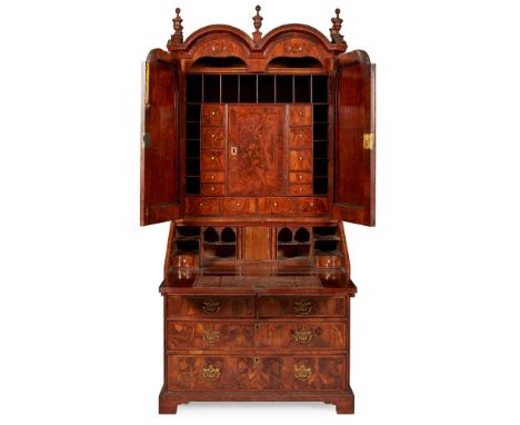 QUEEN ANNE WALNUT AND OAK BUREAU BOOKCASE EARLY 18TH CENTURY, AND LATER the double arch moulded top with turned corner finial