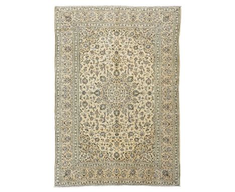 KASHAN CARPET CENTRAL PERSIA, 20TH CENTURY the cream field with light grey medallion, similar spandrels, within light grey pa