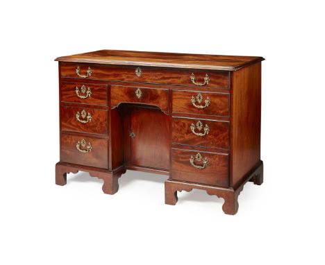 GEORGE III LARGE MAHOGANY KNEEHOLE DESK MID 18TH CENTURY the moulded top above a fitted long frieze drawer and kneehole reces
