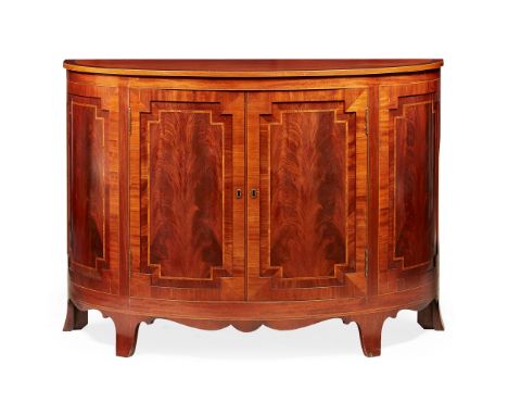 SHERATON STYLE MAHOGANY AND INLAID DEMILUNE SIDE CABINET EARLY 20TH CENTURY with a crossbanded top above twin panelled doors 