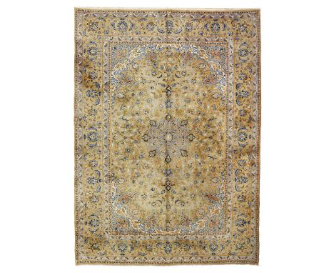 KASHAN CARPET CENTRAL PERSIA, MID 20TH CENTURY the olive green field with light blue medallion, cream and olive spandrels, wi