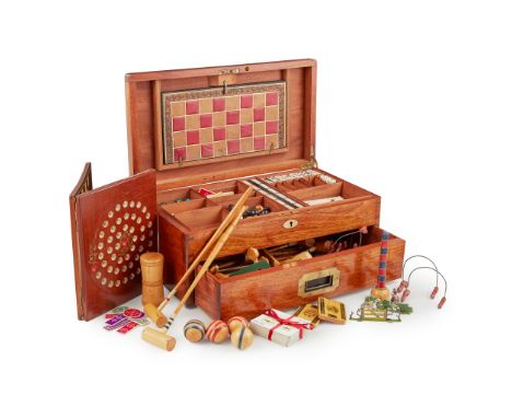 LATE VICTORIAN GAMES COMPENDIUM LATE 19TH CENTURY the mahogany box with brass fittings and base drawer, the fitted interior c