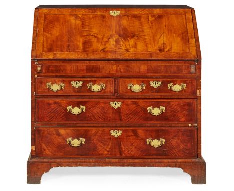 GEORGE I WALNUT BUREAU 18TH CENTURY the cross and chevron banded slant front opening to an arrangement of pigeon holes, drawe