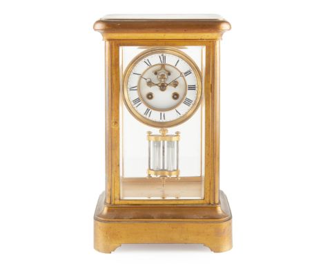 FRENCH BRASS FOUR GLASS MANTEL CLOCK LATE 19TH CENTURY the white enamel Roman numeral dial with a visible escapement and comp