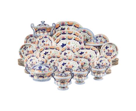 LARGE STONE CHINA PART DINNER SERVICE 19TH CENTURY decorated in the Imari palette with central cobalt blue urns issuing peoni