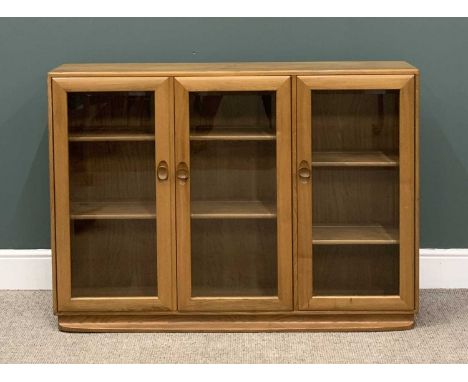 LIGHT ERCOL THREE DOOR BOOKCASE, 97 (h) x 136 (w) x 29 (d) cmsProvenance: Private collection Denbighshire