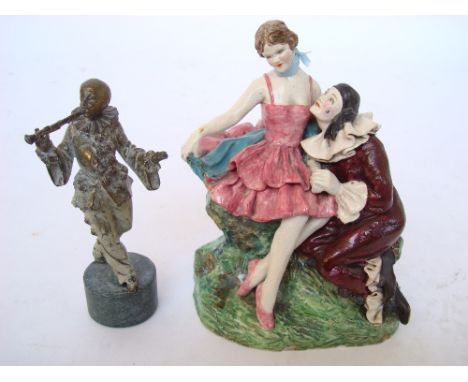 An early 20th Century Continental pottery figure group 'Pierrot & Columbine' (repaired) and a patinated brass figure playing 