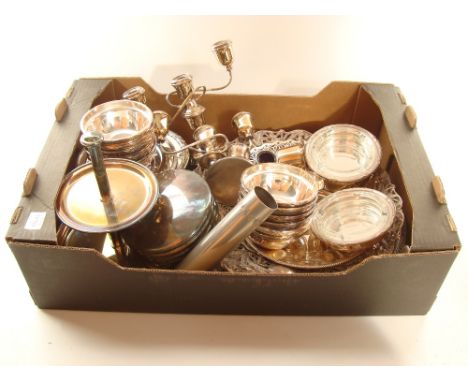 A mixed quantity of EPNS and silver plated items comprising a pair of silver on copper three light candelabra, a large Spanis