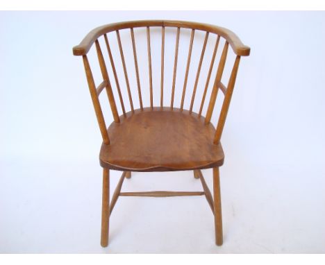 An early 20th Century beech, ash and fruitwood stick back bow armchair, stamped 1306. 