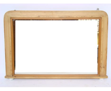 A Victorian pine framed overmantle mirror, on ceramic feet. 